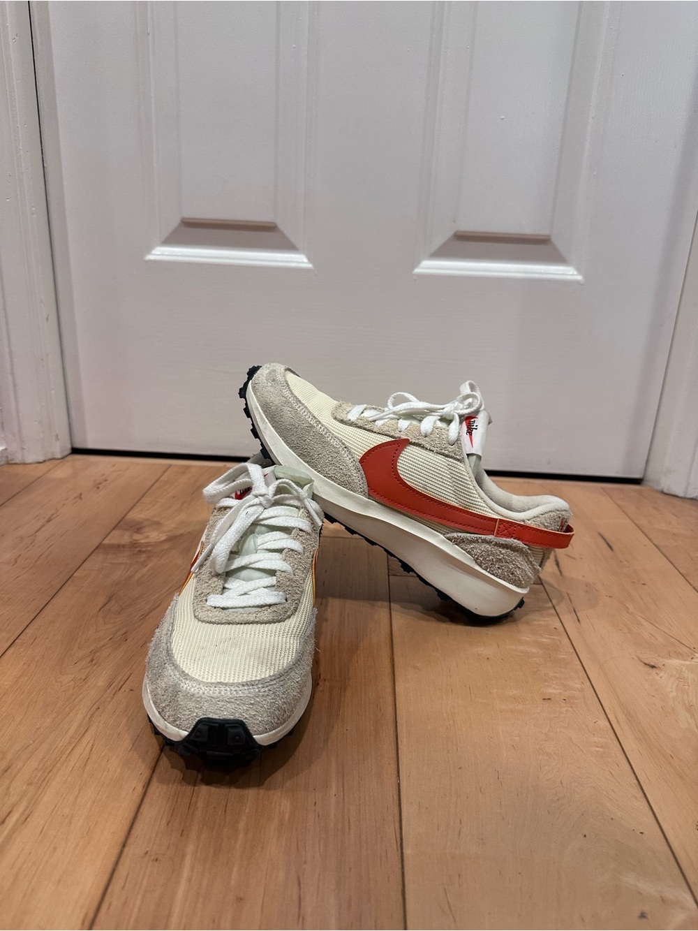 Nike Women’s Retro Runner Sneakers in Cream with Orange Swoosh